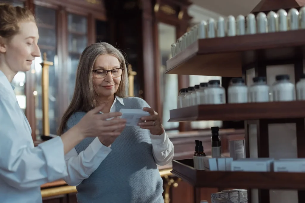 Pharmacist helping a senior woman